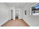Bright bedroom with wood flooring offering a clean, well-lit space with a view from the window at 3397 Janet St, Apopka, FL 32712