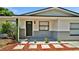 Inviting front entrance with stone walkway, manicured garden, and fresh exterior paint at 3397 Janet St, Apopka, FL 32712