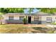 Charming single-story home featuring a well-maintained lawn and lovely landscaping for curb appeal at 3397 Janet St, Apopka, FL 32712