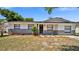 Well-maintained single-story home with manicured landscaping and a welcoming front entrance at 3397 Janet St, Apopka, FL 32712