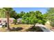 Charming single-story home featuring a well-maintained lawn and a mature shady tree at 3397 Janet St, Apopka, FL 32712