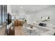 Bright, open-concept living room with hardwood floors, modern furniture, and recessed lighting at 3397 Janet St, Apopka, FL 32712