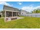 The expansive backyard includes a fire pit, perfect for outdoor entertaining at 3883 Crawley Down Loop, Sanford, FL 32773
