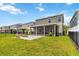 This home features an open backyard, fire pit and screened in porch at 3883 Crawley Down Loop, Sanford, FL 32773
