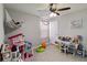 Playful bedroom featuring a dollhouse, hammock, and a decorative table at 3883 Crawley Down Loop, Sanford, FL 32773