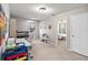 Upstairs flex space with desk, bench and access to a bedroom at 3883 Crawley Down Loop, Sanford, FL 32773