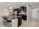 Modern kitchen featuring granite countertops, stainless steel appliances, and ample cabinet space for storage at 3883 Crawley Down Loop, Sanford, FL 32773