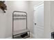 Mudroom with coat rack, bench and shoe storage near the door at 3883 Crawley Down Loop, Sanford, FL 32773