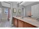 Bathroom featuring a single sink with a large mirror and a combined shower and tub at 4221 Kezar Ct, Belle Isle, FL 32812
