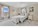 Bedroom with natural light, a comfortable bed, and modern decor at 4221 Kezar Ct, Belle Isle, FL 32812