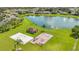 Beautiful community amenities include a playground, sand volleyball court, and a scenic pond with a fountain at 4221 Kezar Ct, Belle Isle, FL 32812