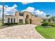 Beautiful home with lush green lawn and palm trees, featuring a circular paver driveway leading to an attached two-car garage at 4221 Kezar Ct, Belle Isle, FL 32812