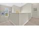 Bright hallway featuring a staircase and a window with blinds at 4221 Kezar Ct, Belle Isle, FL 32812