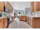 Spacious kitchen with ample cabinet space, modern appliances, and an open layout flowing into the adjacent dining area at 4221 Kezar Ct, Belle Isle, FL 32812