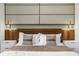 Stylish bedroom featuring modern lighting fixtures, a plush bed, and chic decor at 4310 Lana Ave, Davenport, FL 33897