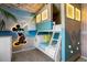 Whimsical themed bedroom features a beachy mural, bunk beds, and surf decor at 4310 Lana Ave, Davenport, FL 33897