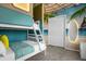 Fun themed bedroom with beach mural, bright bunkbeds, and closet at 4310 Lana Ave, Davenport, FL 33897