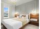 Bright bedroom featuring a bed with a modern headboard, floating nightstands and pendant lighting at 4310 Lana Ave, Davenport, FL 33897