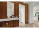 Stylish entryway featuring wood accents, a mirror, and a glimpse into the modern kitchen at 4310 Lana Ave, Davenport, FL 33897