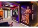 This game room boasts Star Wars themed decor, purple lighting, and a large TV at 4310 Lana Ave, Davenport, FL 33897