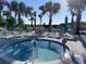 Inviting community hot tub surrounded by lounge chairs, umbrellas and hammocks for a relaxing vacation lifestyle at 4310 Lana Ave, Davenport, FL 33897