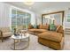 Bright living room with comfortable seating and view of the screened-in outdoor pool area at 4310 Lana Ave, Davenport, FL 33897