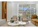 Comfortable seating area with chairs and view of the outdoor screened-in pool at 4310 Lana Ave, Davenport, FL 33897