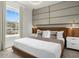 The main bedroom has a king-sized bed, a large window with views, and modern decor at 4310 Lana Ave, Davenport, FL 33897