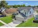 An aerial view of a two-story house showing the surrounding neighborhood and green spaces at 485 Whittingham Pl, Lake Mary, FL 32746