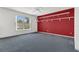 Spacious bedroom features blue carpet, neutral walls, and a row of storage shelves at 485 Whittingham Pl, Lake Mary, FL 32746
