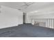 Lofted bonus room features neutral walls and blue carpet at 485 Whittingham Pl, Lake Mary, FL 32746
