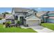 Attractive two-story home showcasing a manicured lawn and welcoming entrance at 485 Whittingham Pl, Lake Mary, FL 32746