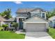 Charming two-story home featuring a well-maintained lawn and inviting front entrance at 485 Whittingham Pl, Lake Mary, FL 32746