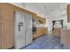 Bright kitchen featuring a stainless steel refrigerator, oven, and wood cabinetry at 485 Whittingham Pl, Lake Mary, FL 32746