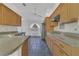 Well-lit kitchen featuring granite countertops, stainless steel appliances, and wood cabinetry at 485 Whittingham Pl, Lake Mary, FL 32746