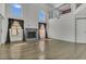 Spacious living room with high ceilings, hardwood floors, large windows, and a fireplace at 485 Whittingham Pl, Lake Mary, FL 32746