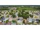 This is an aerial view showing a dense neighborhood with houses and many trees at 485 Whittingham Pl, Lake Mary, FL 32746