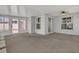 Enclosed sunroom with neutral carpet, lots of windows, and a ceiling fan at 485 Whittingham Pl, Lake Mary, FL 32746