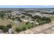 Wide aerial view displays multiple homes in green landscape in a neighborhood near a community center at 4895 Cr 134B, Wildwood, FL 34785