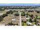 An aerial view features a peaceful neighborhood with large lots and mature landscaping nestled in a tranquil setting at 4895 Cr 134B, Wildwood, FL 34785