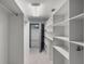Basement or storage room featuring a secure vault door and built-in shelving units at 4895 Cr 134B, Wildwood, FL 34785