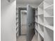 Secured basement with heavy door and shelving at 4895 Cr 134B, Wildwood, FL 34785