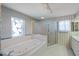 Bright bathroom featuring a garden tub, separate shower, and decorative stained glass window at 4895 Cr 134B, Wildwood, FL 34785