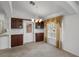 Charming dining area with carpet, cabinets, and natural light, a cozy space for meals and conversation at 4895 Cr 134B, Wildwood, FL 34785