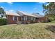 Charming brick home showcasing well-maintained landscaping and a fountain at 4895 Cr 134B, Wildwood, FL 34785