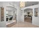 Bright open foyer featuring arched doorways, tile accents, and views to the living spaces at 4895 Cr 134B, Wildwood, FL 34785