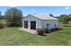 Aerial view of the garage featuring multiple bays, convenient access, and ample outdoor space at 4895 Cr 134B, Wildwood, FL 34785