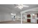 Bright and airy living area featuring high ceilings, neutral tones, and open layout connecting various living spaces at 4895 Cr 134B, Wildwood, FL 34785