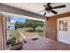 Covered brick patio offers a cool, shaded outdoor space with a ceiling fan at 4895 Cr 134B, Wildwood, FL 34785