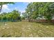 Large backyard surrounded by a wooden fence, providing privacy and space at 5160 Wood Ridge Ct, Ocoee, FL 34761